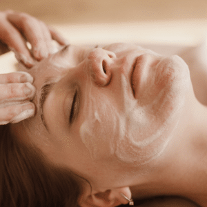 Woman getting her face cleansed during a classic facial.